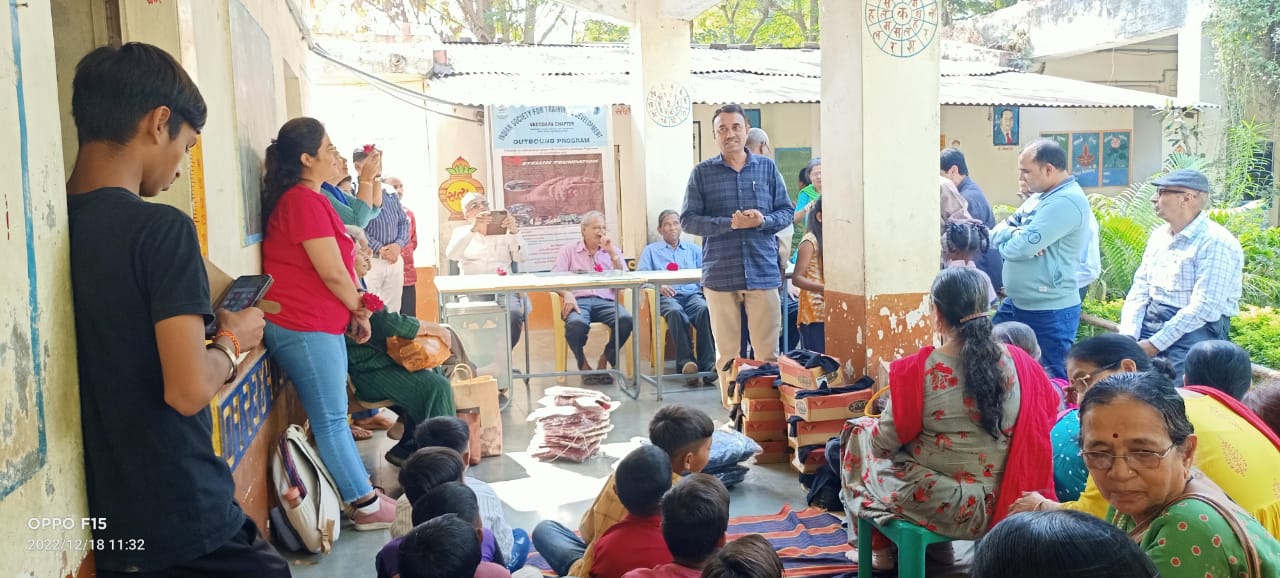 Free distribution of sweaters, schoolbags, caps, shoes, biscuits to 18 students of class 5 of Dudhapura Primary School.