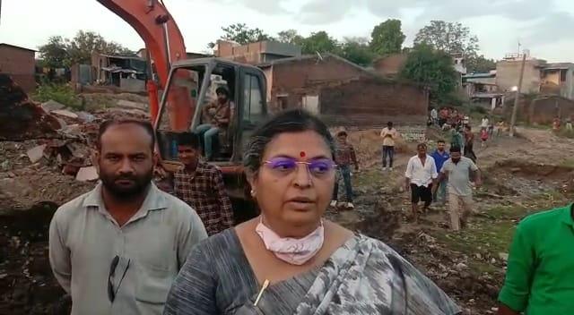 male-officer-carrying-out-demolition-for-beautification-of-kalol-lake