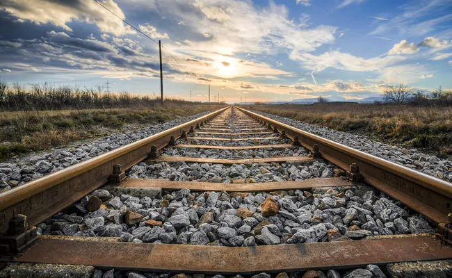 Why train tracks do not rust, what kind of iron is this that shines even after rain?