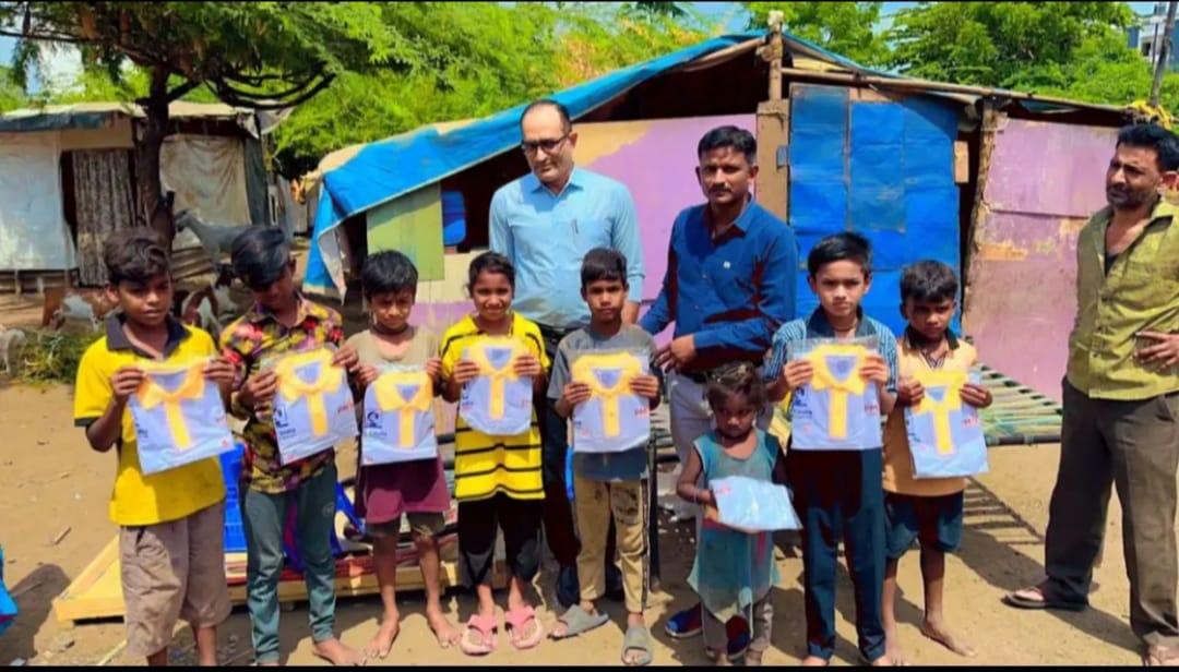 Surat Collector Office Officials Give Education Kits to Adopted Street Children