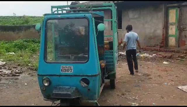 Slaughterhouse manager carrying animal waste from public road in Langani Dubai