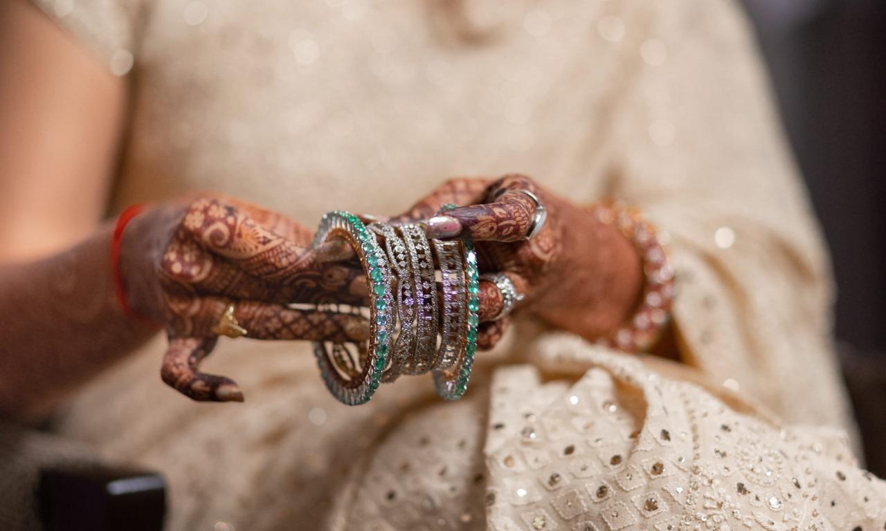 This special design of bangle will enhance the beauty of the bride's hand